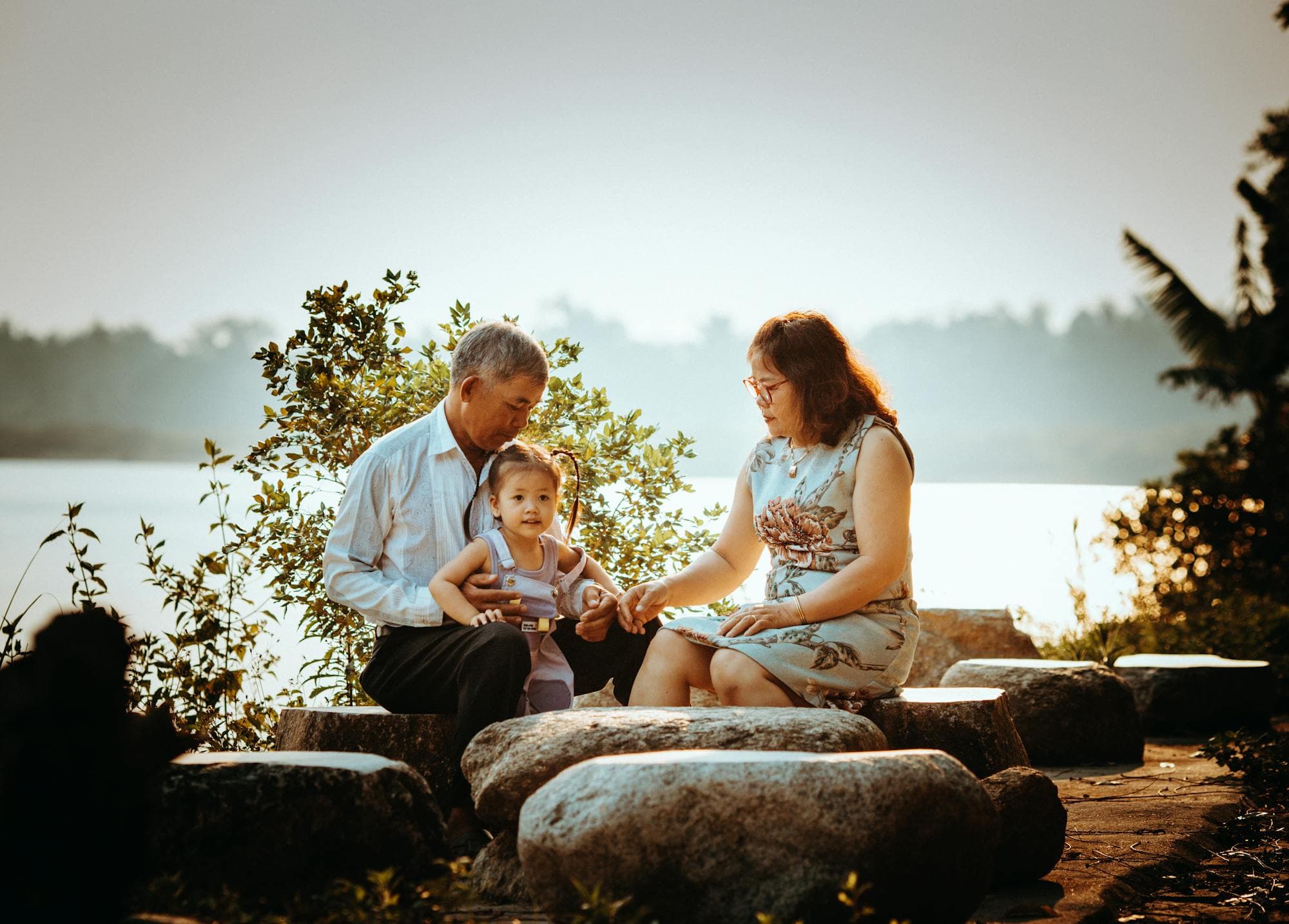 Asian family relaxing together at home